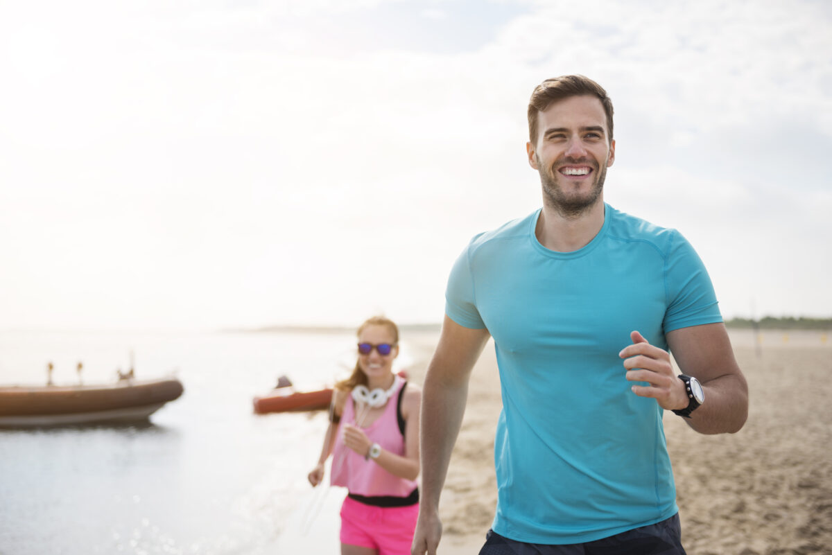 close-up-young-fit-people-jogging-by-sea-1200x801.jpg